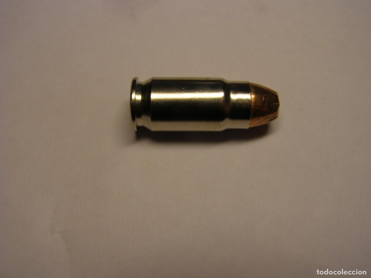 Militaria: Cartucho inerte calibre 40 SUPER