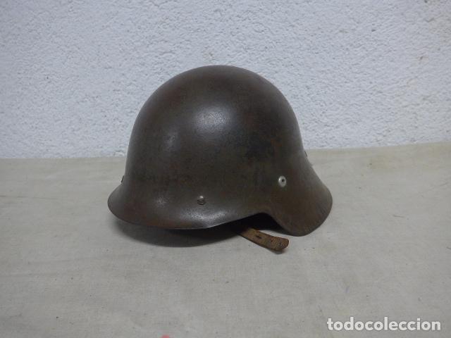 Militaria: Antiguo casco m-26 con alas original, color gris, trubia, guerra civil. Nunca reutilizado