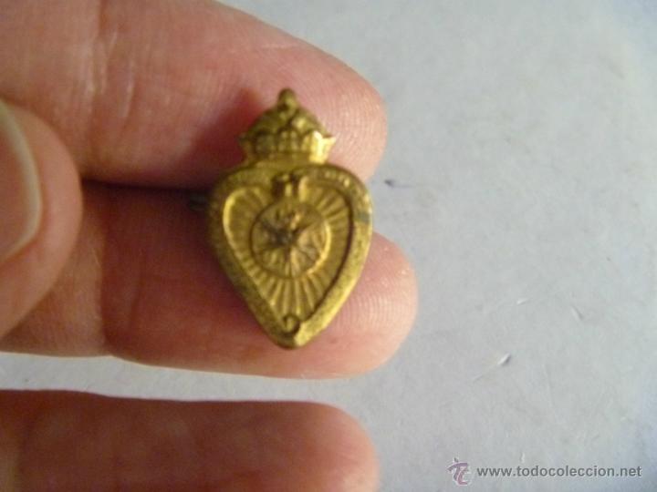 Militaria: GUERRA CIVIL : PEQUE&Ntilde;O DETENTE BALA ( CORAZON DE JESUS Y CORONA REAL ) DE METAL