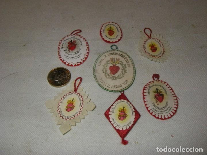 Militaria: Lote de 7 detentes diferentes, amuleto, detente bala o detente enemigo.