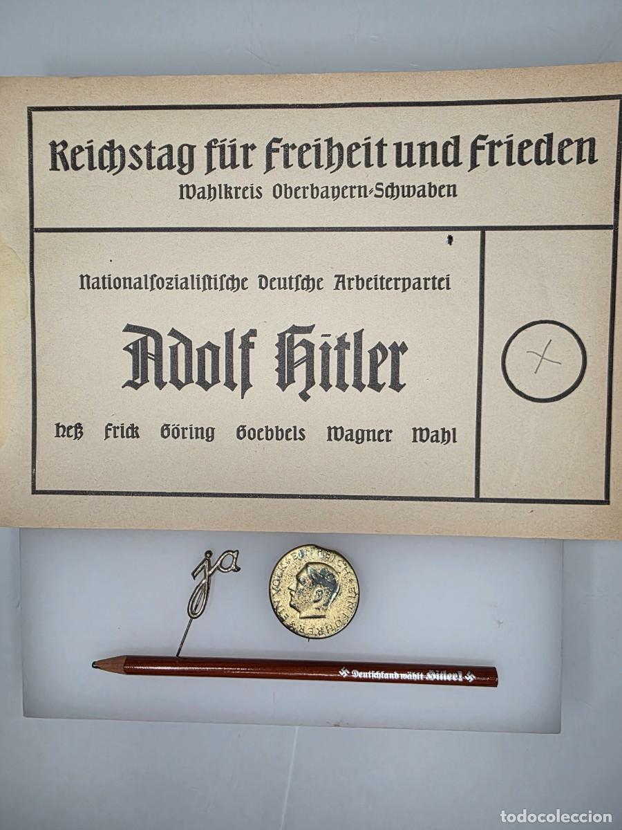 Militaria: Lote original electoral Hitler 1933-1936: papeleta Reichstag, l&aacute;piz y dos insignias IIWW III Reich