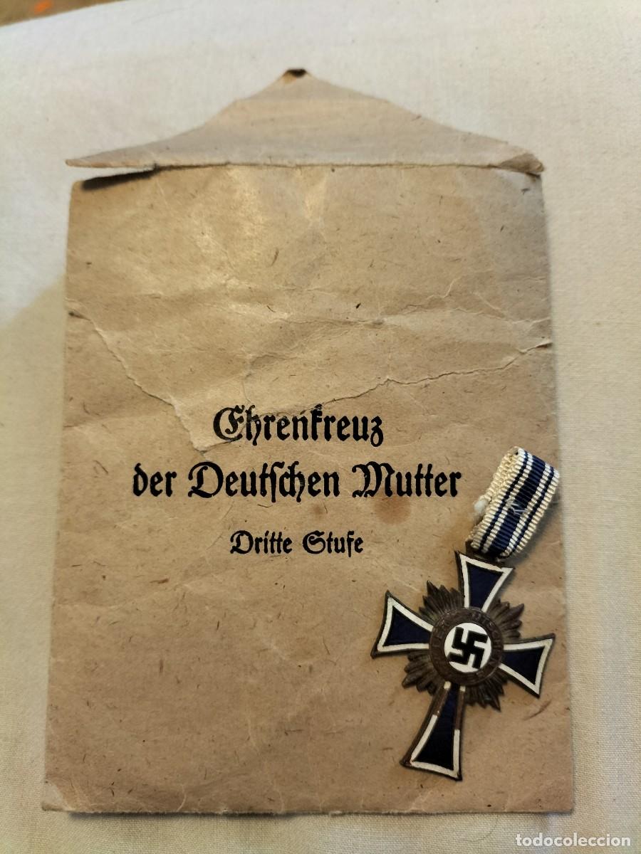 Militaria: Cruz de la Madre en bronce con su sobre de entrega. Alemania Nazi. III Reich. ORIGINAL.
