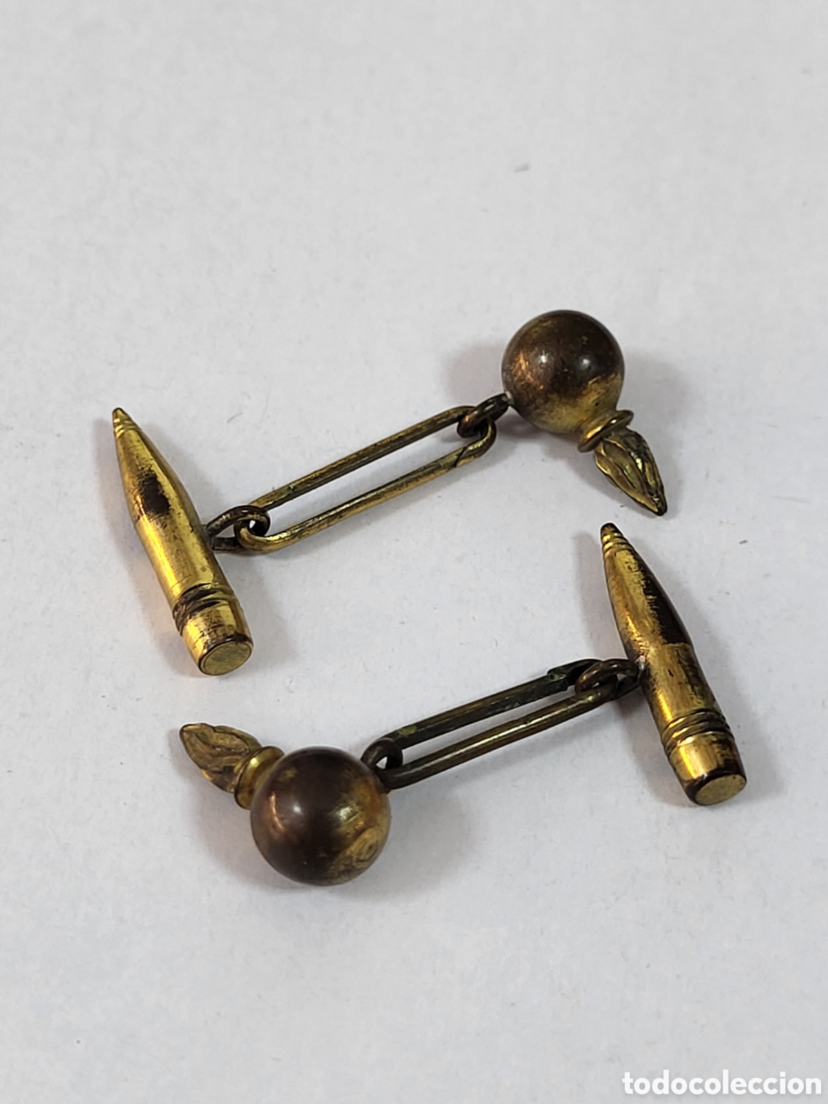 Militaria: ANTIGUOS GEMELOS MILITARES . ARTILLERIA. BOMBA Y PROYECTIL