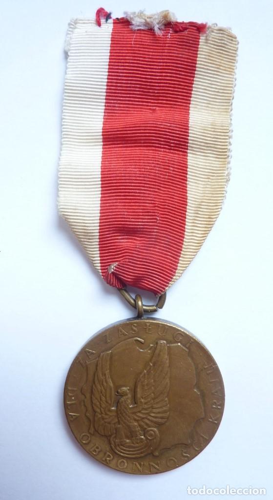 Militaria: Polonia: Medalla al Mérito en la Defensa Nacional. Categoría de oro. - Foto 1 - 138666878