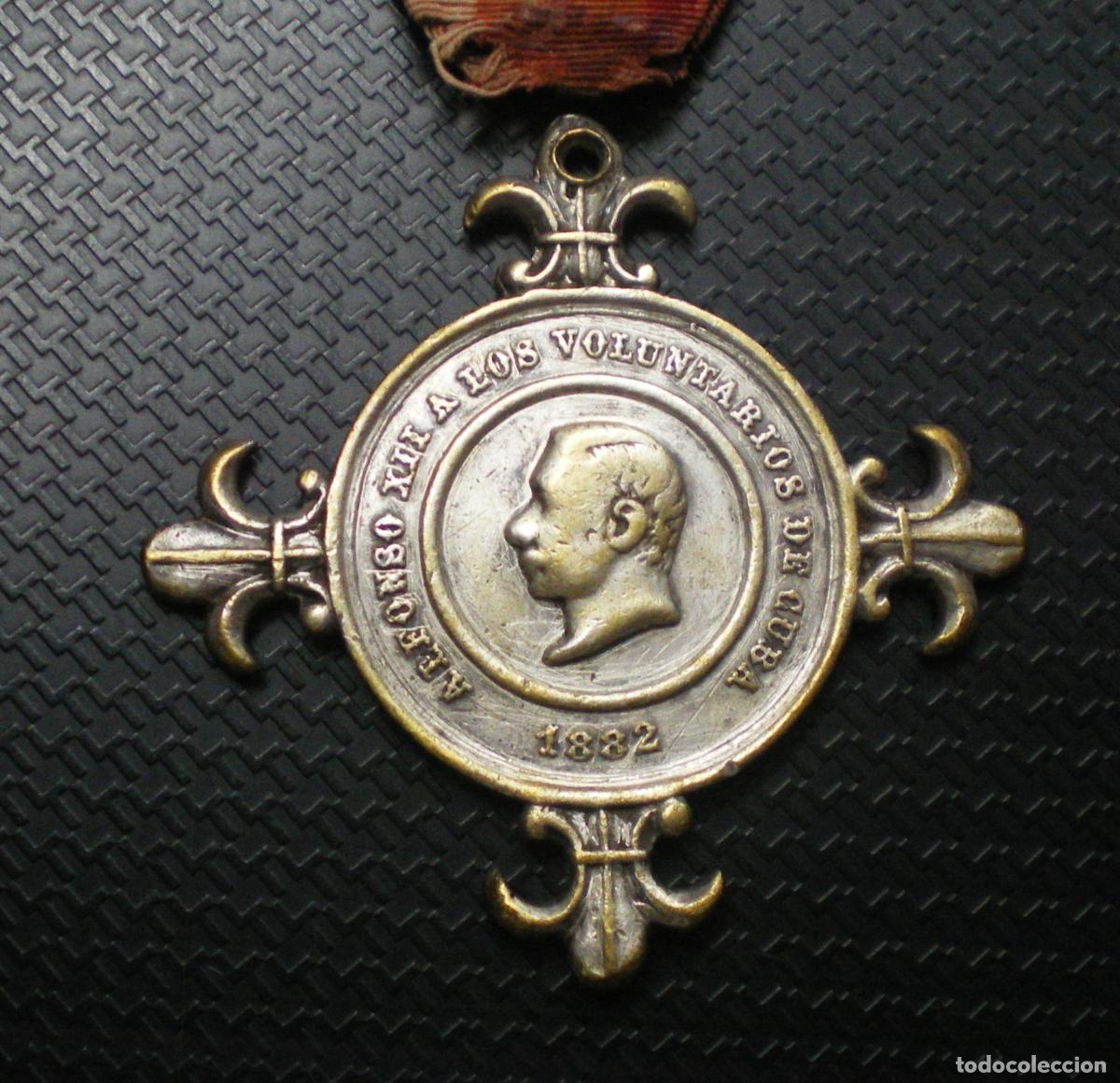 Militaria: VOLUNTARIOS GUERRA de CUBA - MEDALLA de PLATA 1882 - 2 PASADORES y CINTA ORIGINAL
