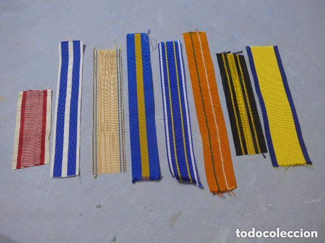 Militaria: Lote 8 cintas de medalla extranjera a identificar.