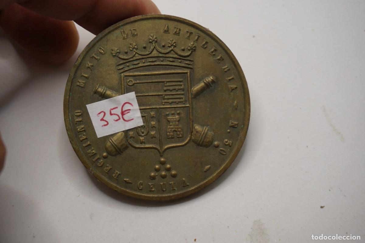 Militaria: CHAPA MILITAR BRONCE - REGIMIENTO MIXTO DE ARTILLERIA N&ordm; 50 - CEUTA - 5 CM DE DIAMETRO