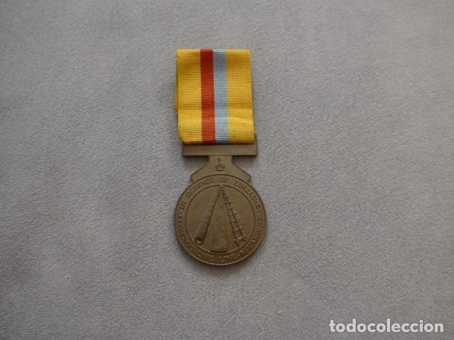 Militaria: Antigua medalla de la Defensa de Zimbawe, original y numerada.