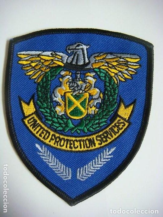 Militaria: PARCHE DE TELA DE UNITED PROTECTION SERVICES