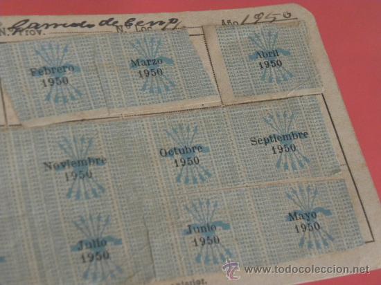 Militaria: 12 Cupones Falange pegados en carnet 1950