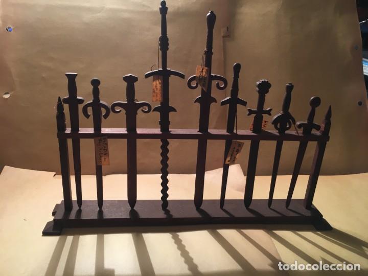 Military Antiques: ANTIGUA COLECCION DE ESPADAS REALIZADAS EN MADERA A MANO EN CAMPO DE CONCENTRACION 9 ESPADAS 23,5