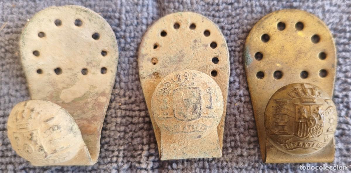 Militaria: Tres especies de trabillas con bot&oacute;n de Infanter&iacute;a.