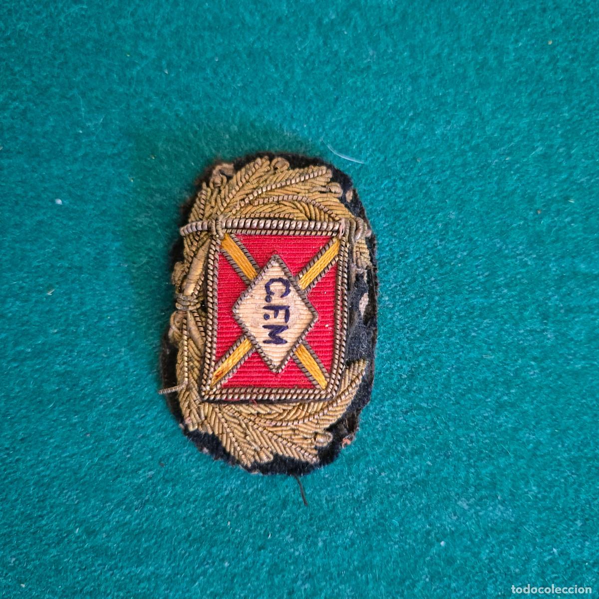 Militaria: parche de tela C F M