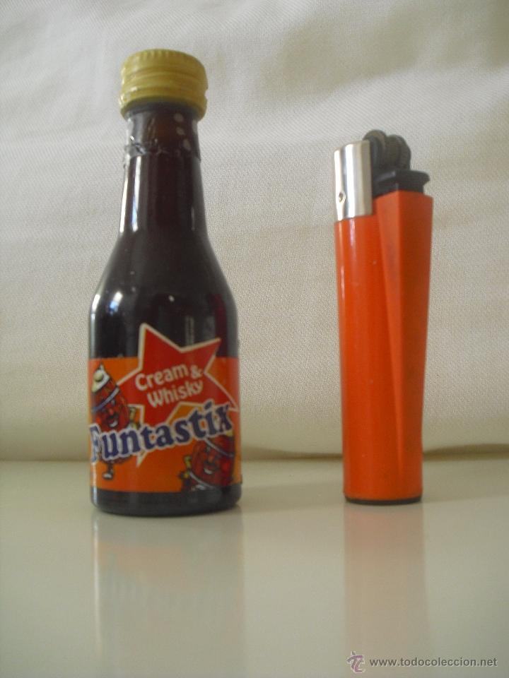 Miniaturas de perfumes antiguos: MIni botella, botellin en miniatura. Funtastix cream & Whisky . Crema . Botellita. Minibotella.