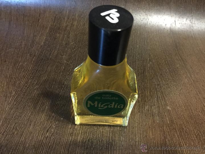 Miniaturas de perfumes antigos: Preciosa botella de perfume EAU DE TOILETTE MIGDIA - Girona. Mide aprox 11X5cm.aprox
