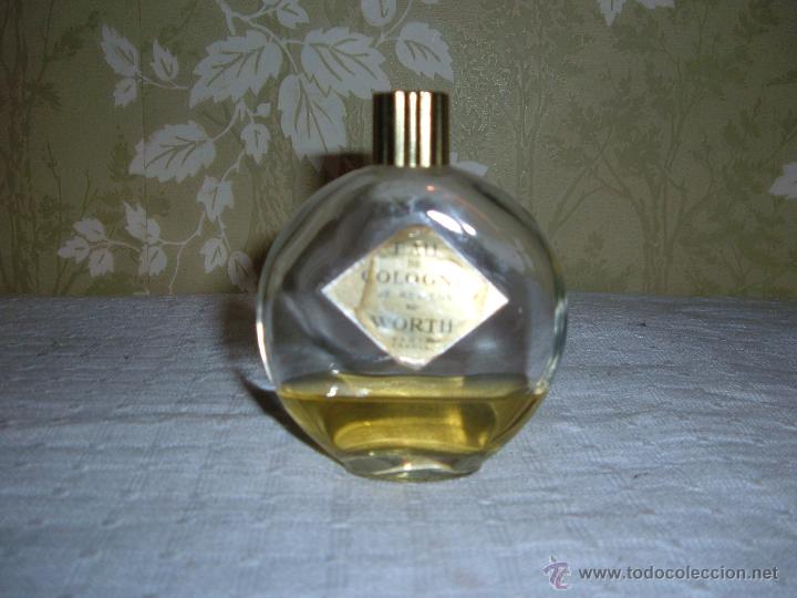 Miniaturas de perfumes antiguos: Botella de Colonia EAU de Colonia Je Reveus Worth Francia altura 9,5 cm