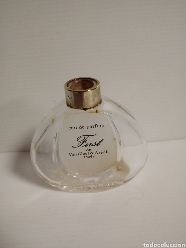 Miniaturas de perfumes antiguos: Botella de eau de perfum vacia de first para mujer - Foto 1