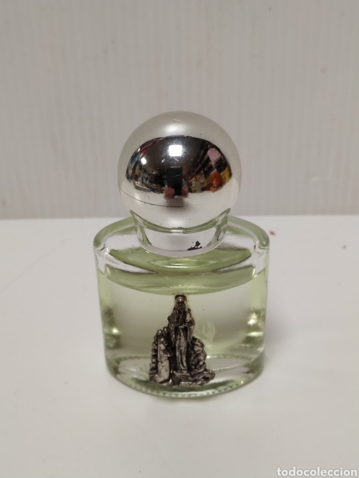 Miniaturas de perfumes antigos: Botella de colonia miniatura con virgen