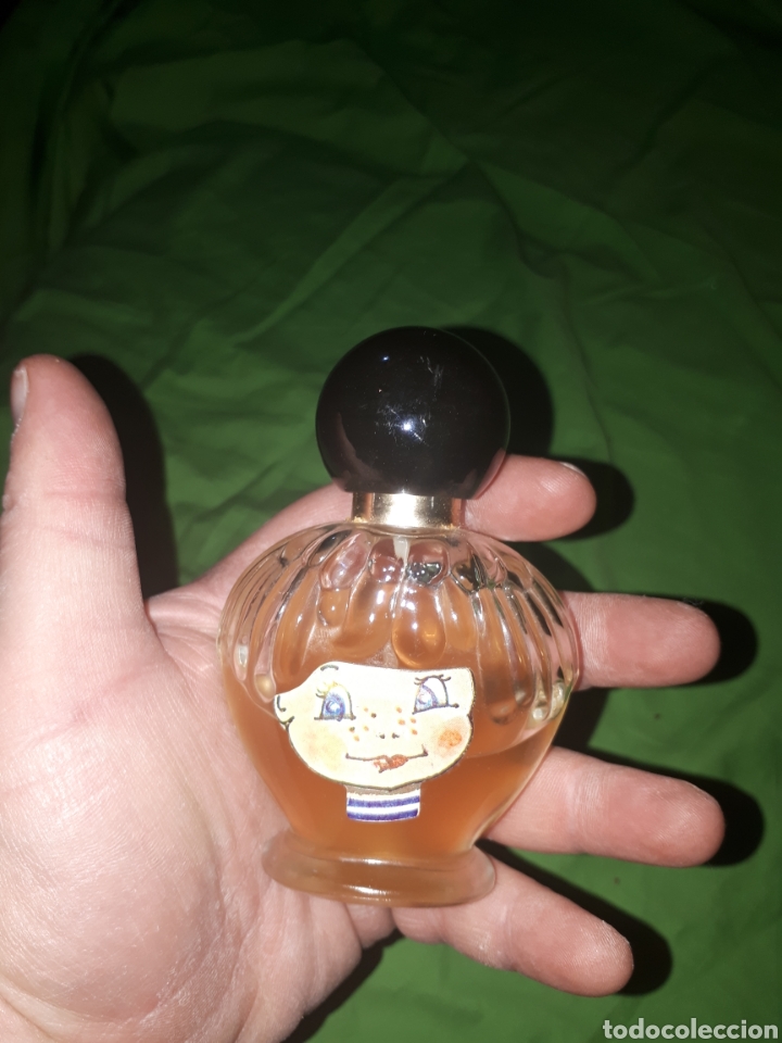 Miniaturen von alten Parf&uuml;men: Curiosa colonia con cara en etiqueta no lleva marca es de 50 ml.