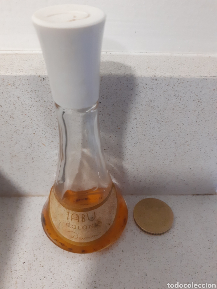 Miniaturas de perfumes antiguos: Botella de Colonia tabu - Foto 2