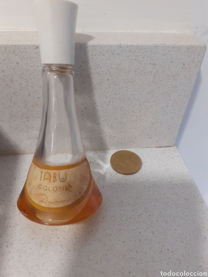 Miniaturas de perfumes antiguos: Botella de Colonia tabu - Foto 1