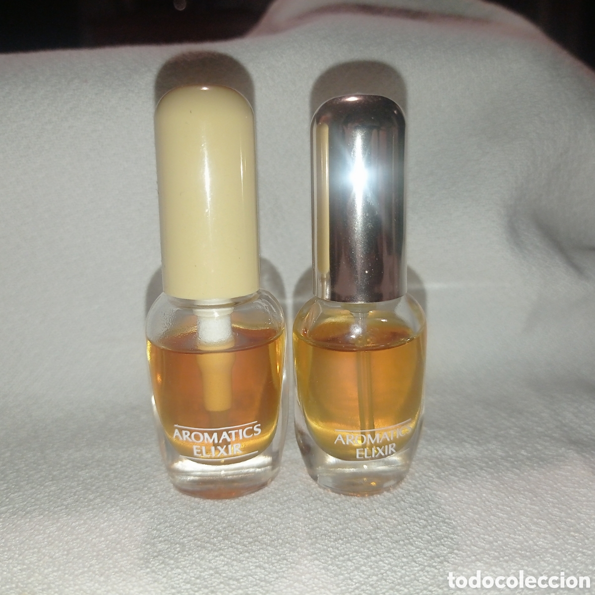 Miniature di profumi antiche: Lote Perfume miniatura AROMATICS ELIXIR, de CLINIQUE, Vaporizador