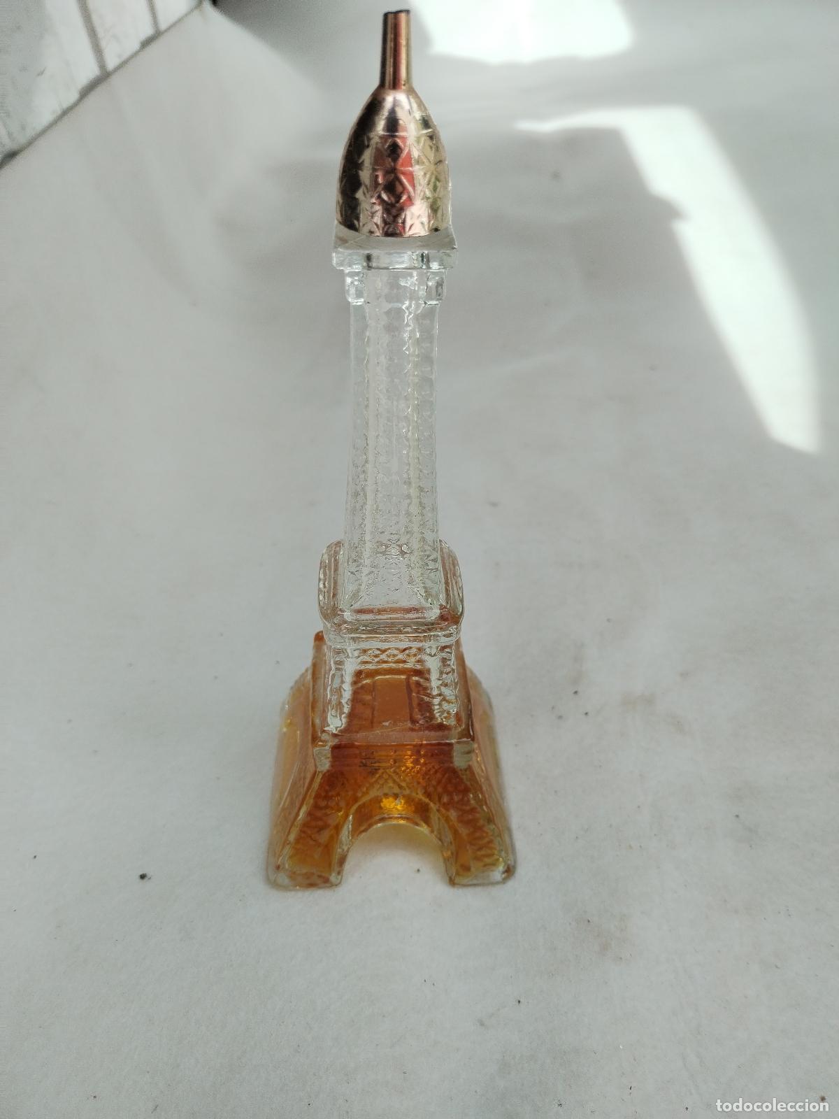 Miniaturas de perfumes antiguos: colonia avon botella torre eiffel