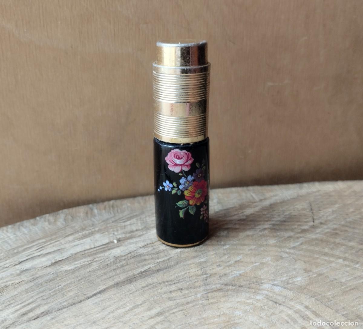 Miniaturas de perfumes antiguos: Perfumero de bolso vintage de cer&aacute;mica o similar con ornamento colorido de flores. Marca Luxus.