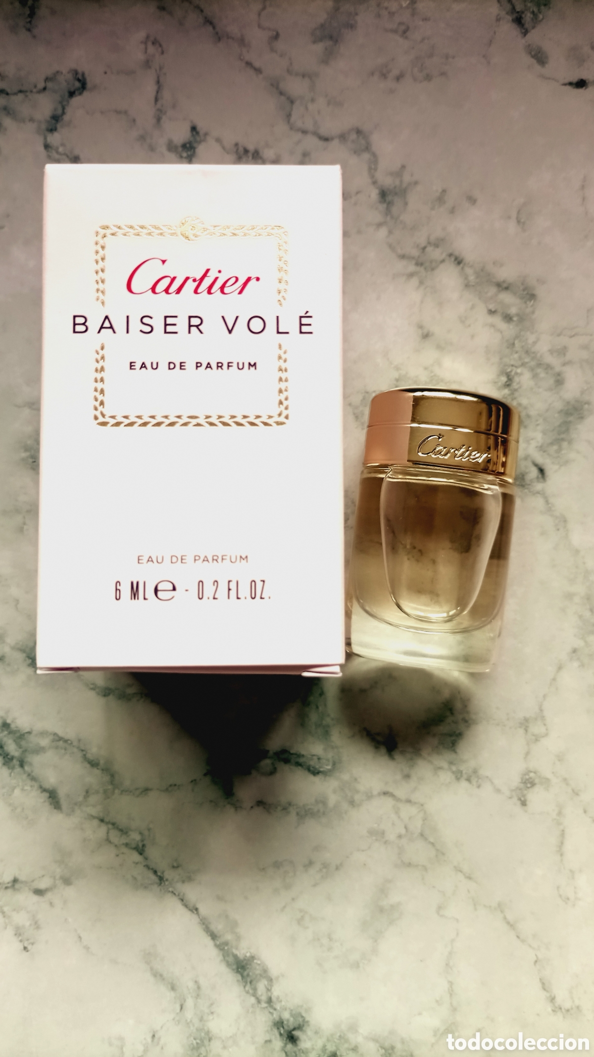 Miniaturas de perfumes antiguos: Miniatura Baiser Vol&eacute; de Cartier 6ml EDP