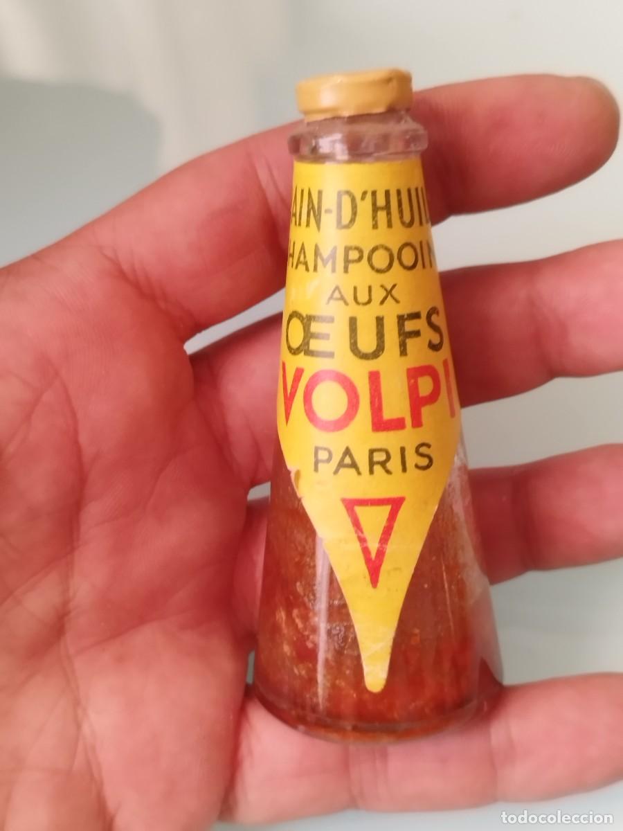 Miniaturas de perfumes antiguos: Antiguo frasco de champ&uacute; de vidrio publicitario antiguo de champ&uacute; al huevo de la marca Volpi Paris.