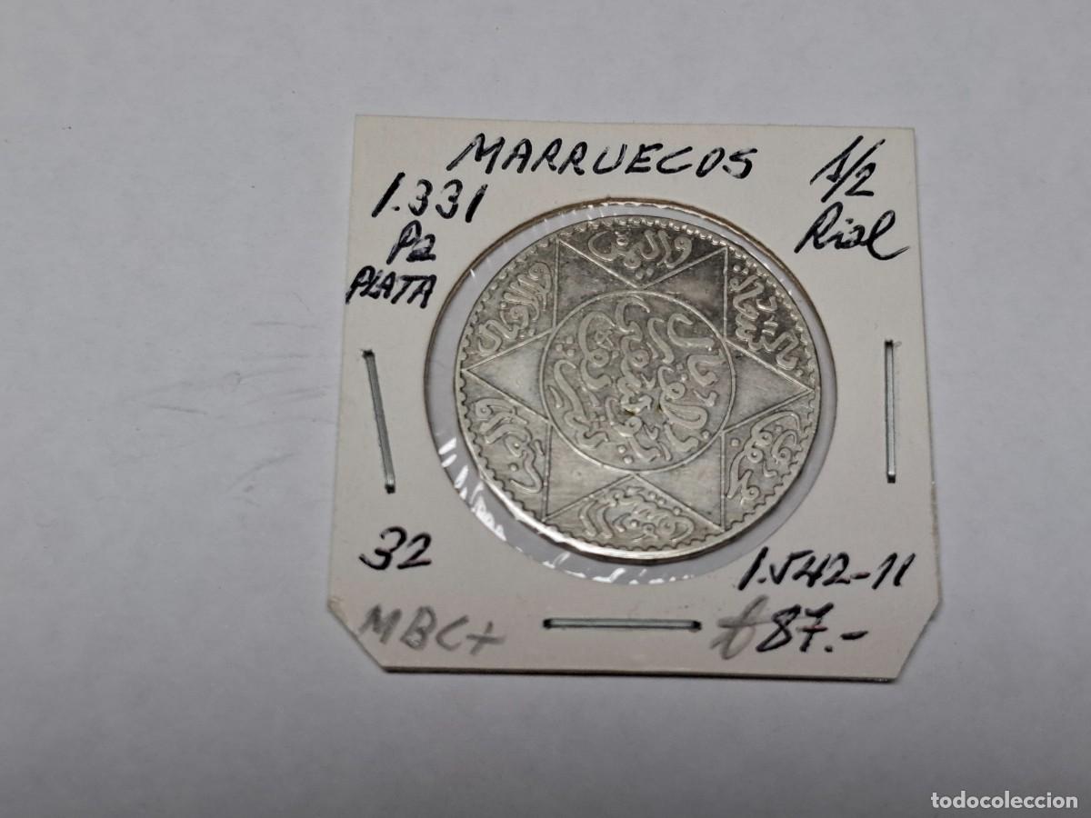 Monedas antiguas de &Aacute;frica: 1/2 de RIAL de PLATA de 1331 Pa KM 32 MARRUECOS en MBC+