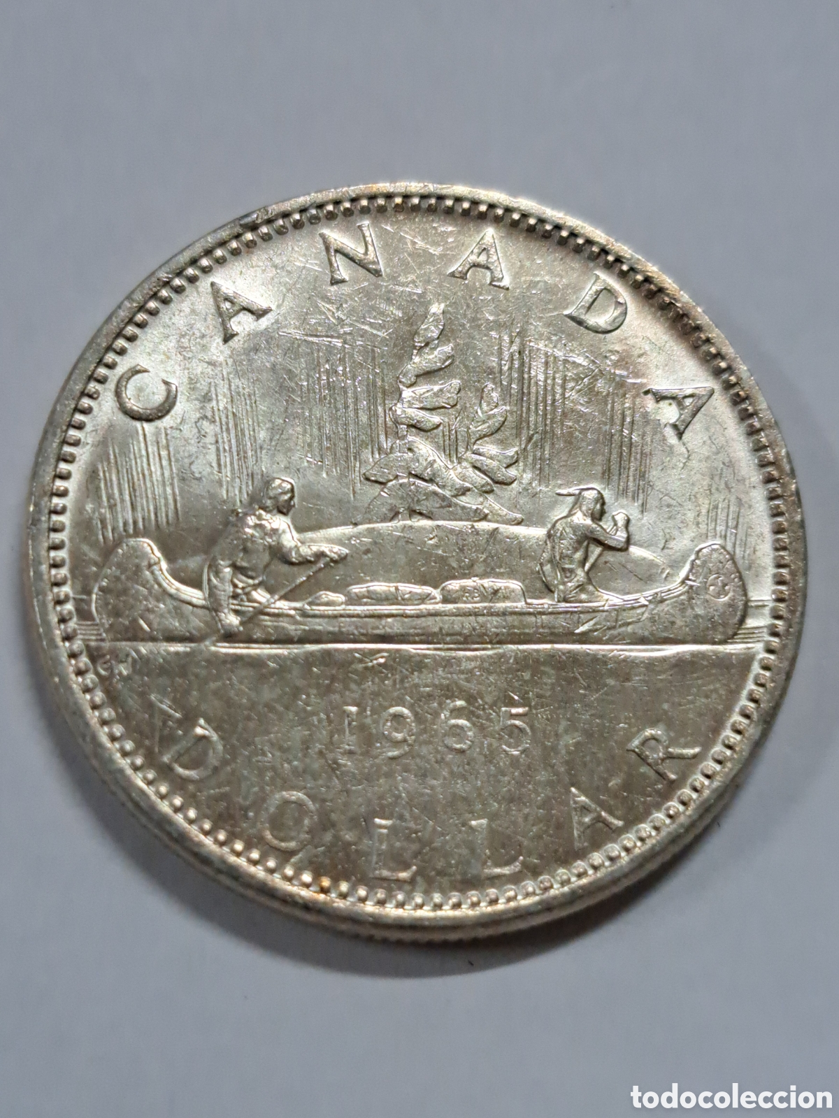 Monedas antiguas de Am&eacute;rica: D&oacute;lar de plata a&ntilde;o 1965 de Canad&aacute;