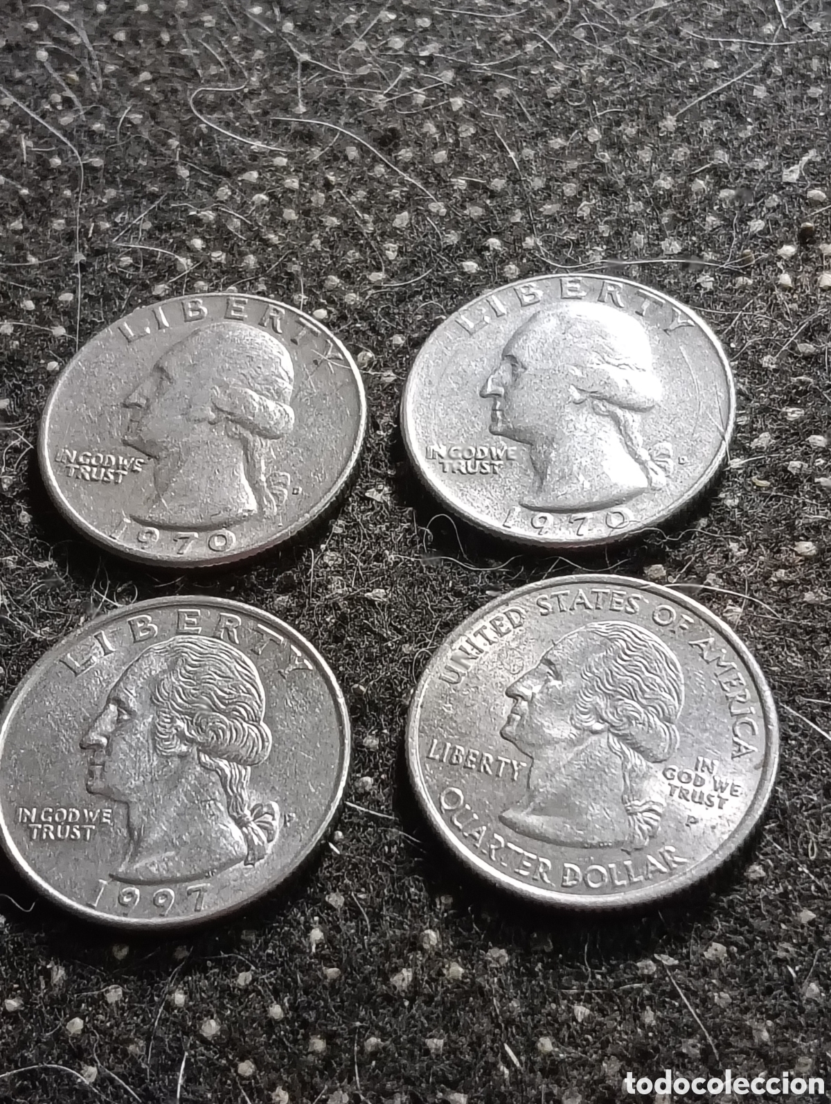 Monedas antiguas de Am&eacute;rica: Lote de 4 monedas de 1/4 de dolar 2 de 1970 - 1 de 1997 y 1 de 2004, todas circuladas.