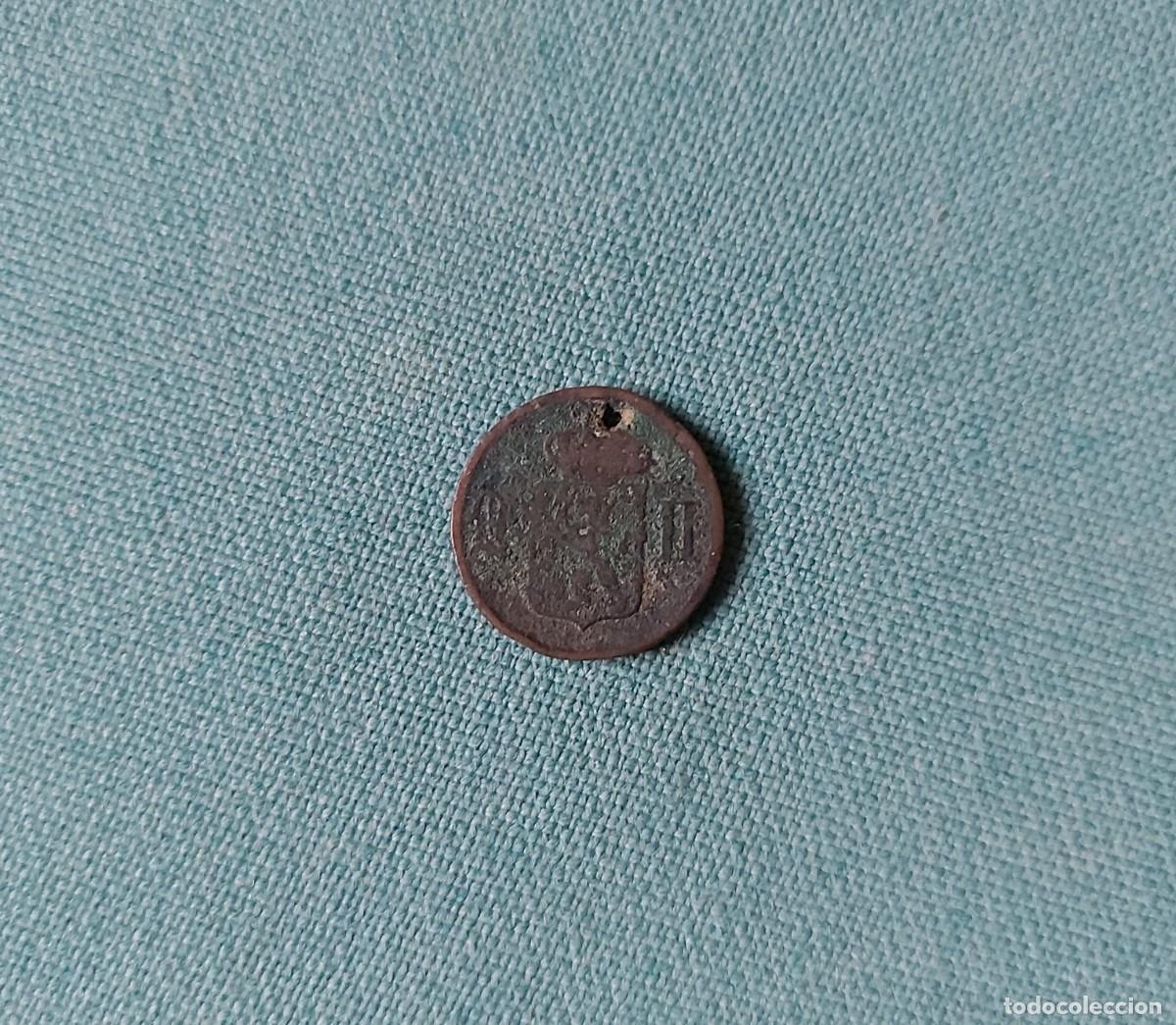 Monedas con errores: Moneda perforada a catalogar - Foto 1