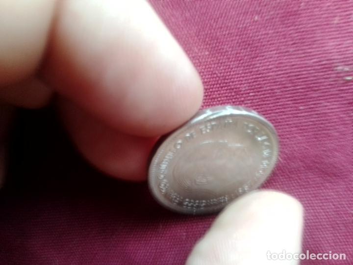 Monedas con errores: 25 pesetas de 1957 estrella 67 SC con cospel segmentado - Foto 3