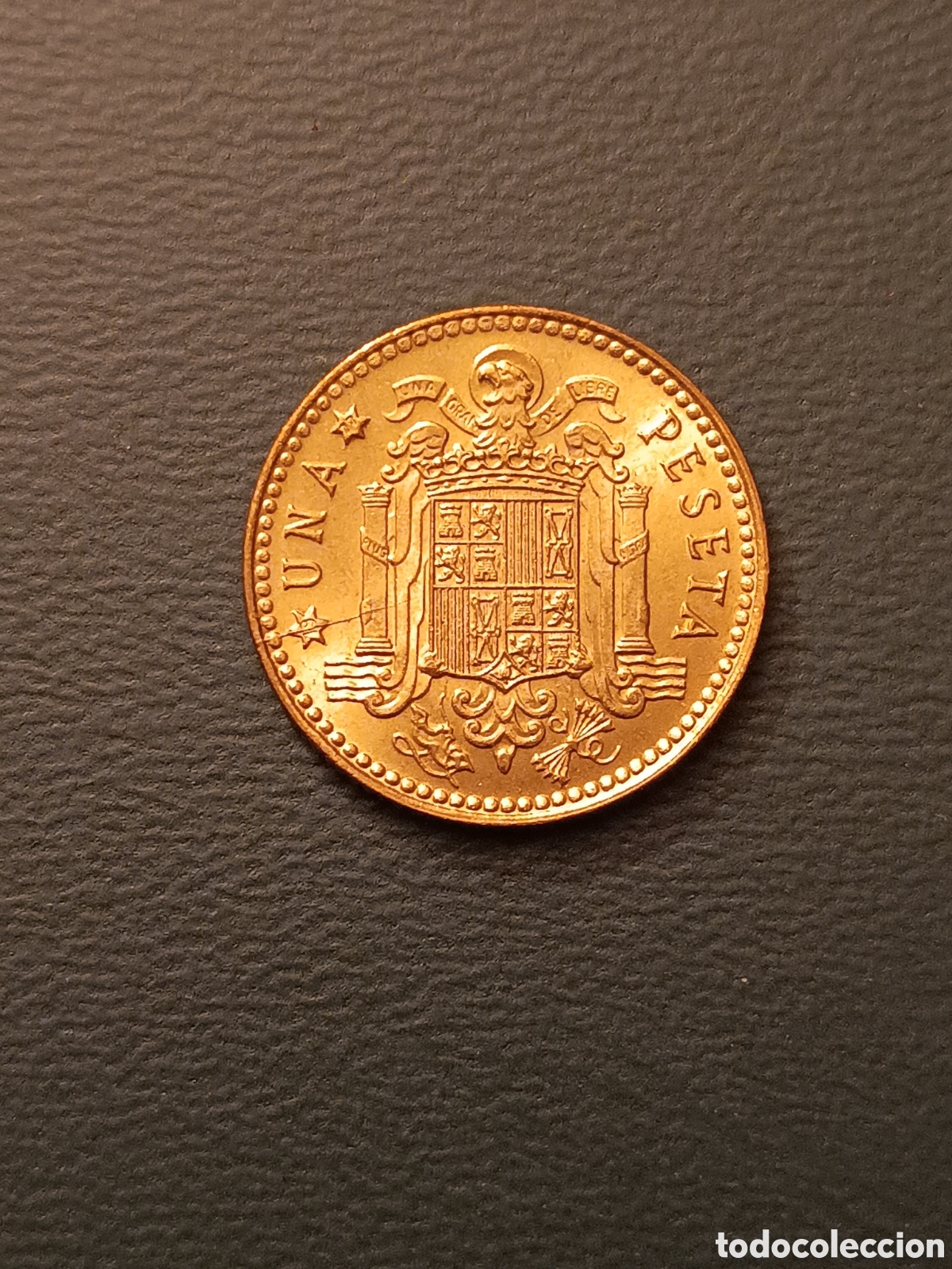 Moedas com erros: ERROR EXCESO DE METAL EN LA ESTRELLA DEL 19 UNA RAYA - 1 PESETA 1975 *77 - JUAN CARLOS I