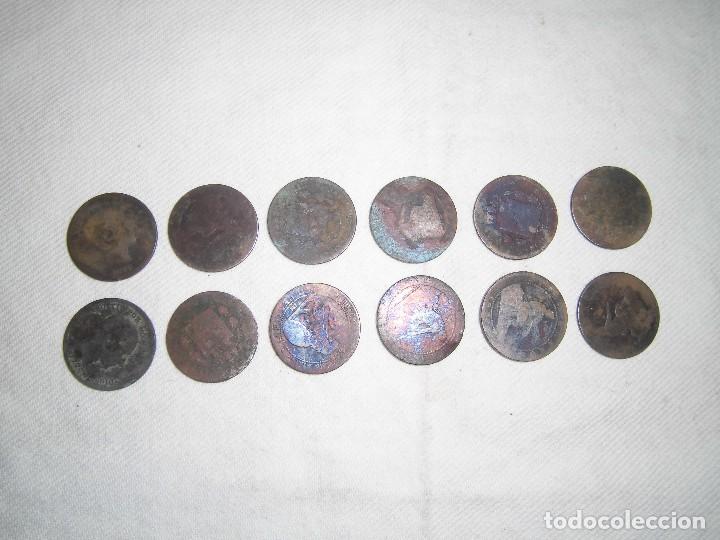 Monedas de Espa&ntilde;a: 12 monedas usadas de cobre 1879 - Foto 1