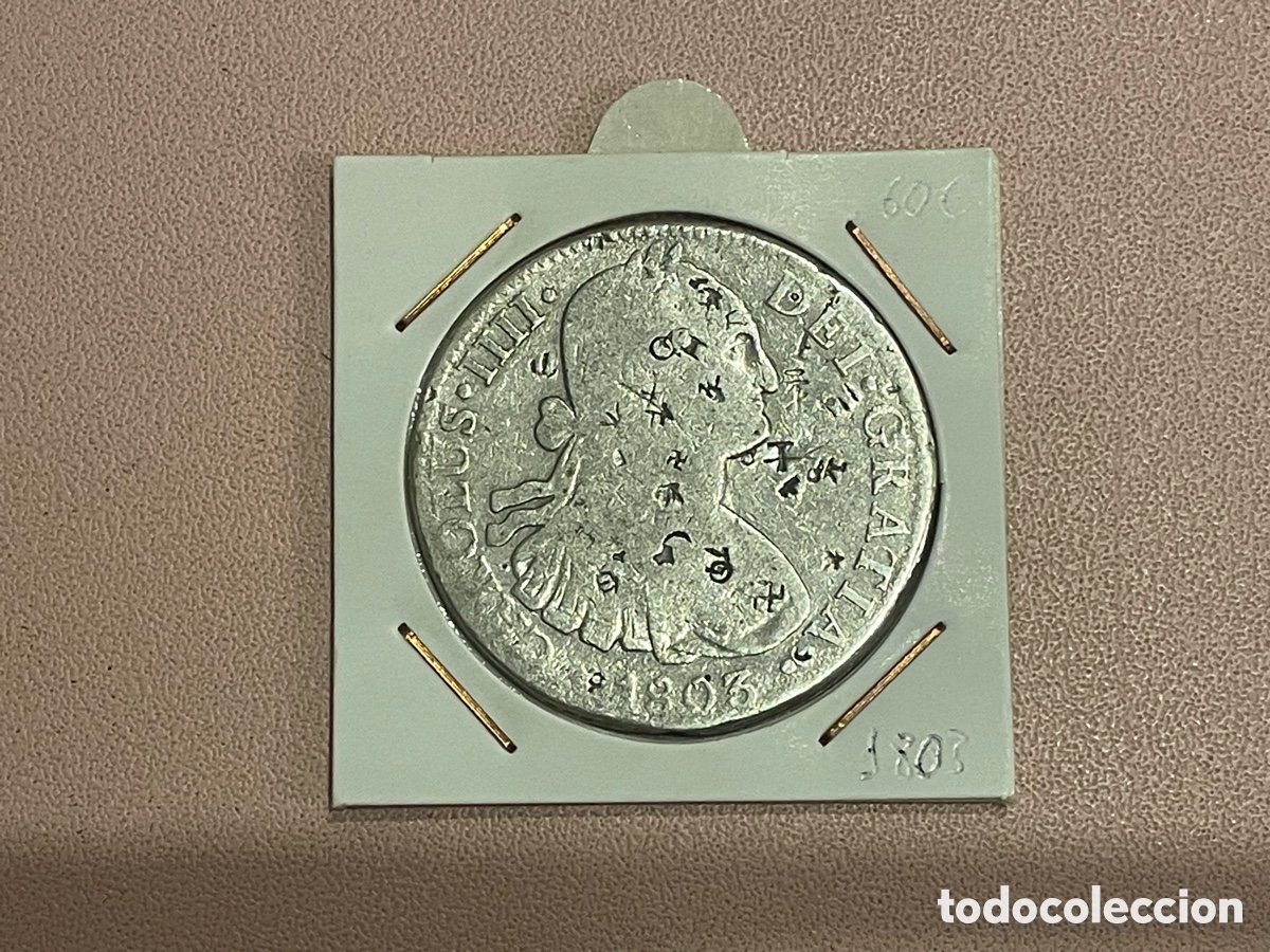 Monedas de Espa&ntilde;a: 8 Reales Carlos IV 1803 M&eacute;xico plata con resellos orientales (chopmarks)