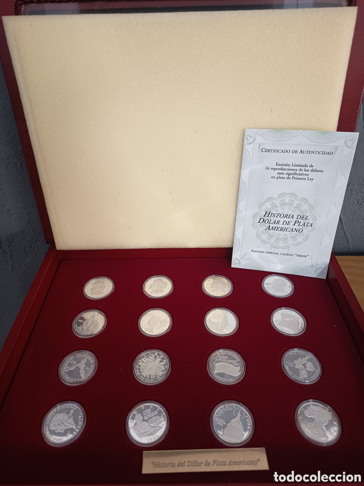 Monedas FNMT: HISTORIA DEL DOLAR DE PLATA AMERICANO 16 MONEDAS DE PLATA 925MM 217GR