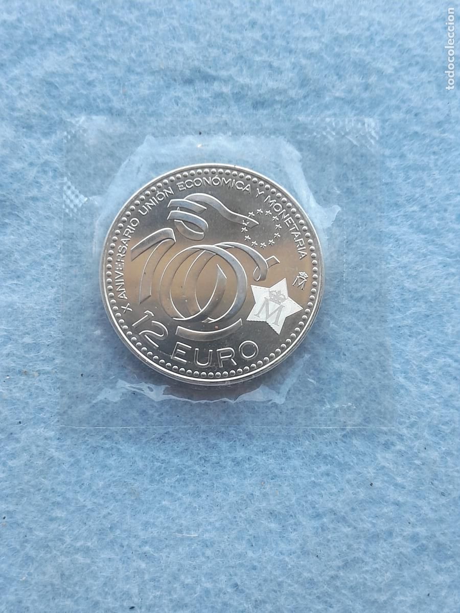 Monedas FNMT: Juan Carlos I. 12 Euros. X Aniversario Uni&oacute;n Econ&oacute;mica y Monetaria. A&ntilde;o 2009. Plata.