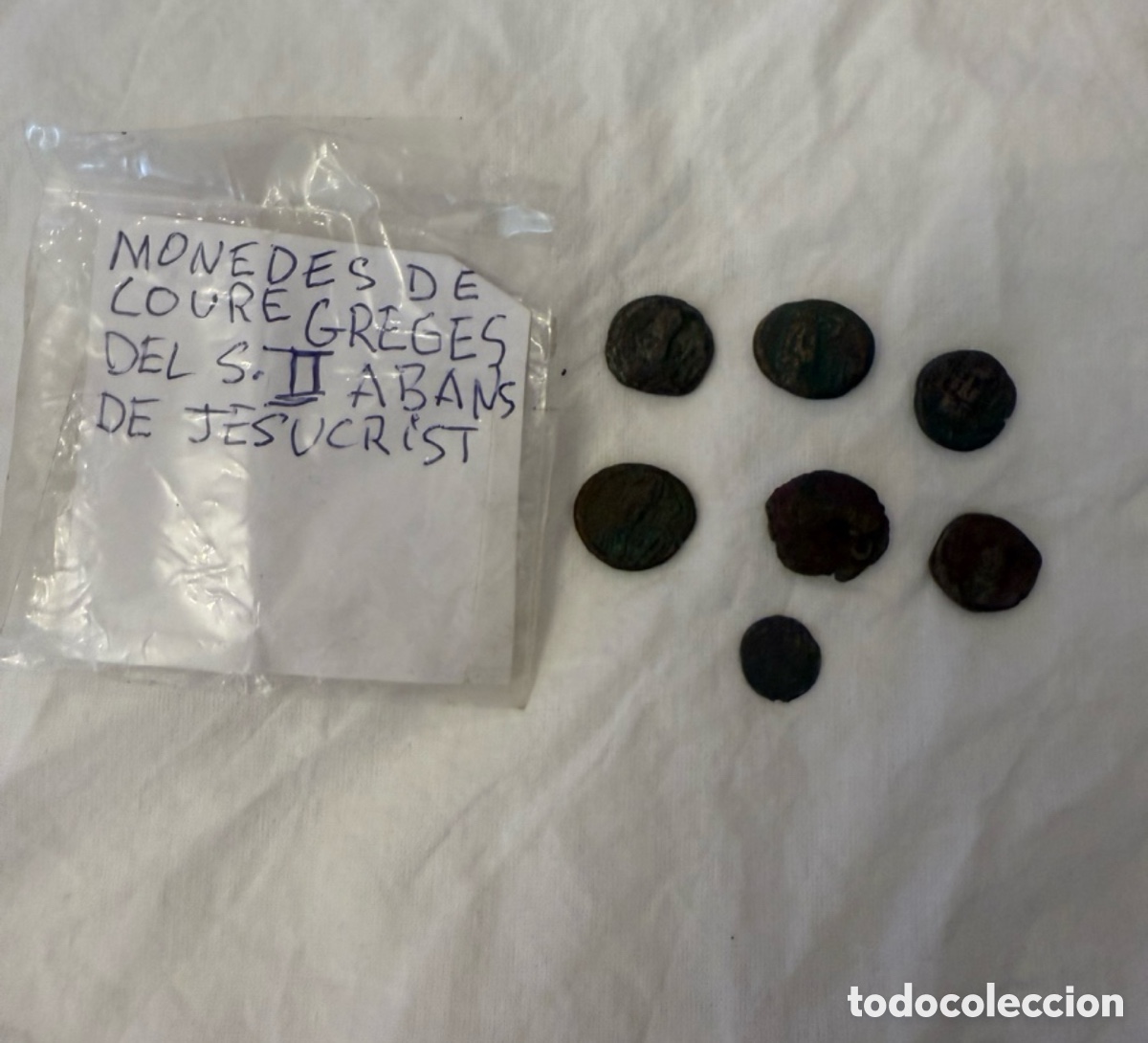 Monedas Grecia antigua: Lote de 7 Monedas Griegas Originales de Cobre &ndash; Siglo II a.C. &ndash; Antigua Colecci&oacute;n Privada con Nota
