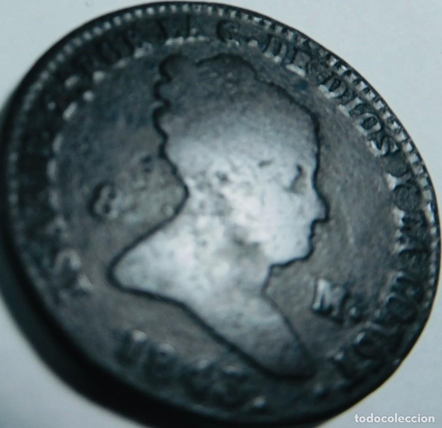 Monedas Hispano &aacute;rabes: moneda hist&oacute;rica de cobre espa&ntilde;ola del reinado de Isabel II,