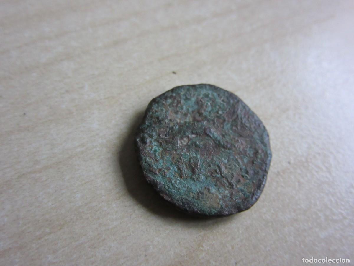 Monedas ib&eacute;ricas: Cuadrante de Gades (C&aacute;diz) S I AC Anverso Cabeza de H&eacute;rcules Reverso Delf&iacute;n