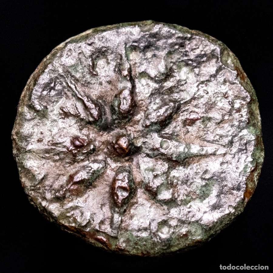 Monedas ib&eacute;ricas: Malaca. Cuadrante de bronce, 150-80 a.C. Estrella de ocho rayos.