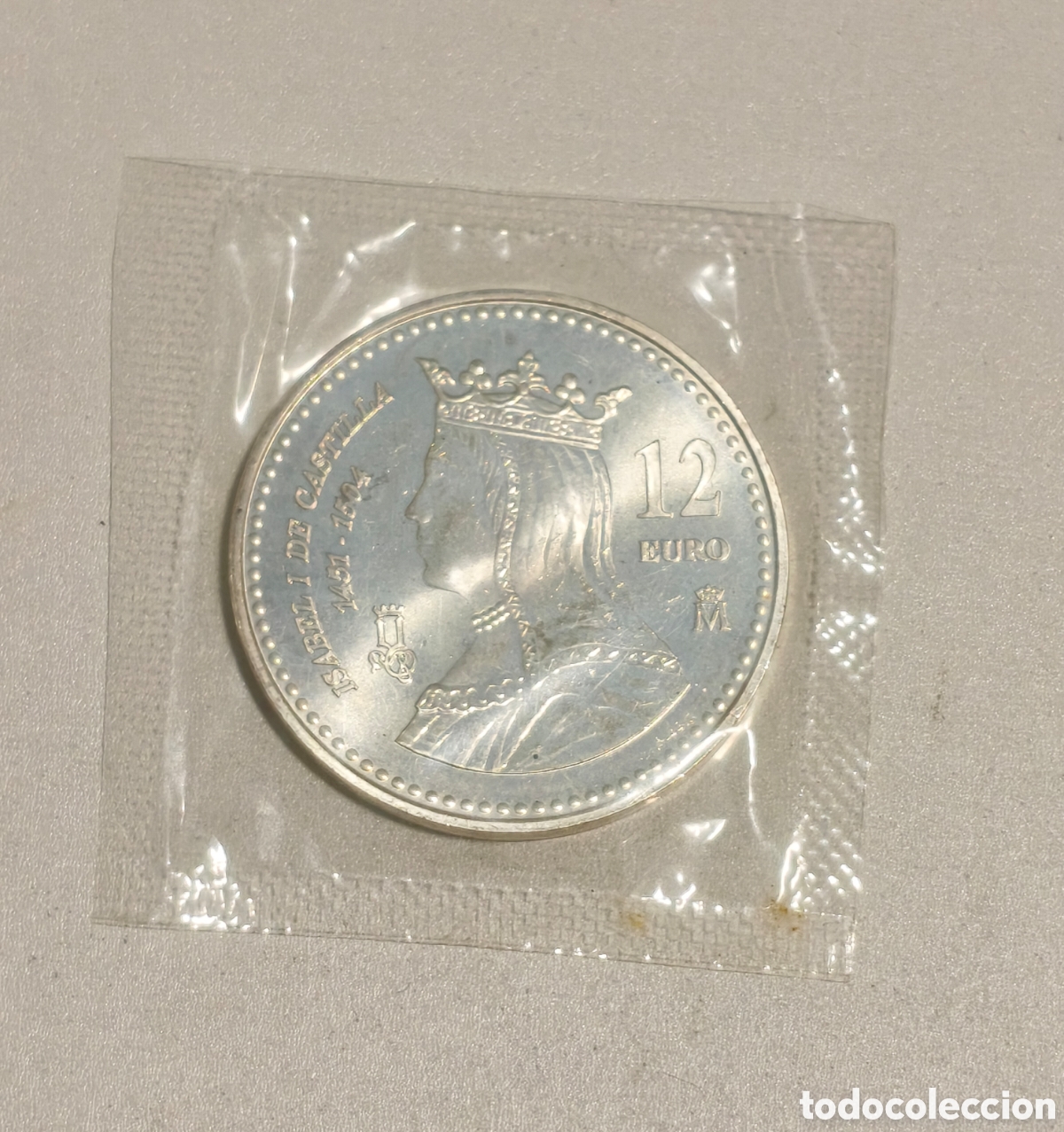 Monedas Juan Carlos I: 12 EUROS ESPA&Ntilde;A PLATA 2004 SC PRECINTO FNMT. ANIVERSARIO MUERTE ISABEL II