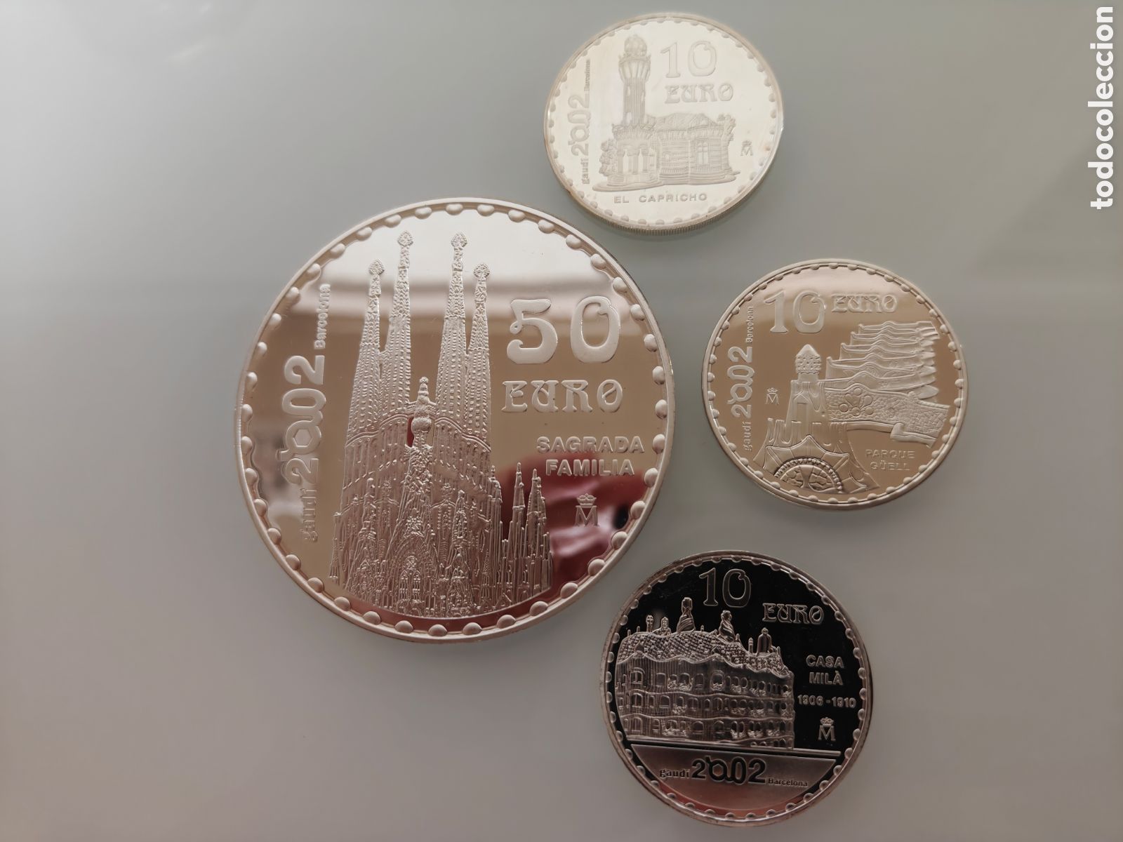 Monedas Juan Carlos I: SET CINCUENTIN 5 ONZAS PLATA SAGRADA FAMILIA 2002 GAUDI + 10&euro; CASA MILA, PARK G&Uuml;ELL Y CAPRICHO COMPL