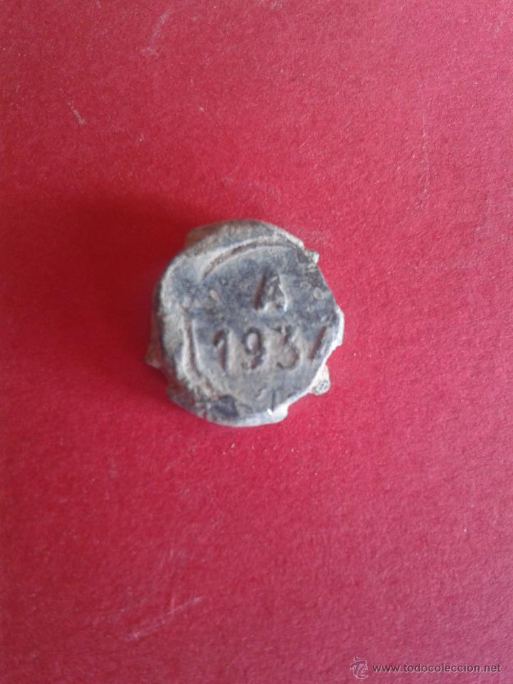 Monedas locales: ANTIGUO MARCHAMO DE PLOMO. A. 1934. - Foto 1