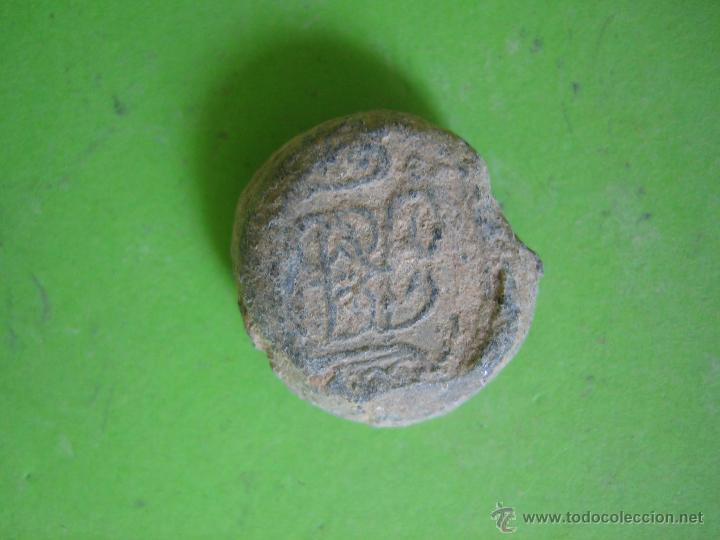 Moedas locais: Ficha o precinto de env&iacute;os de sacas