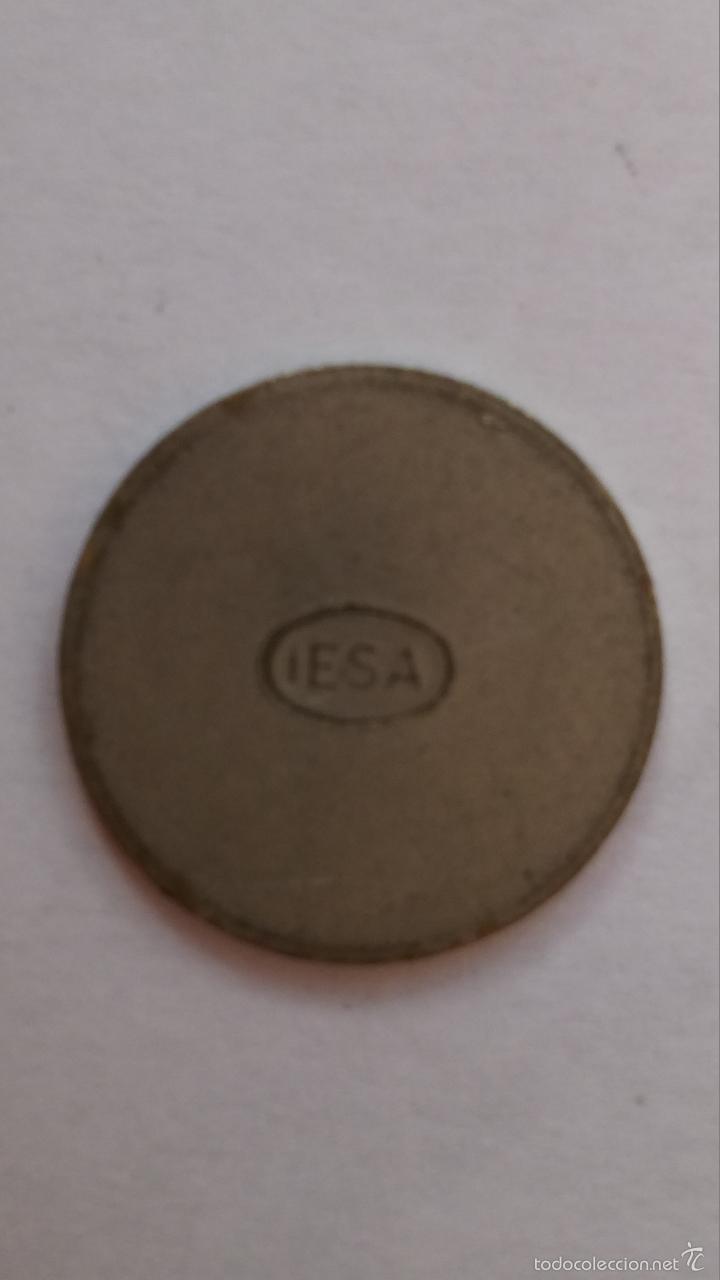 Moedas locais: ficha, moneda iesa solo una cara de 2 cms de diametro