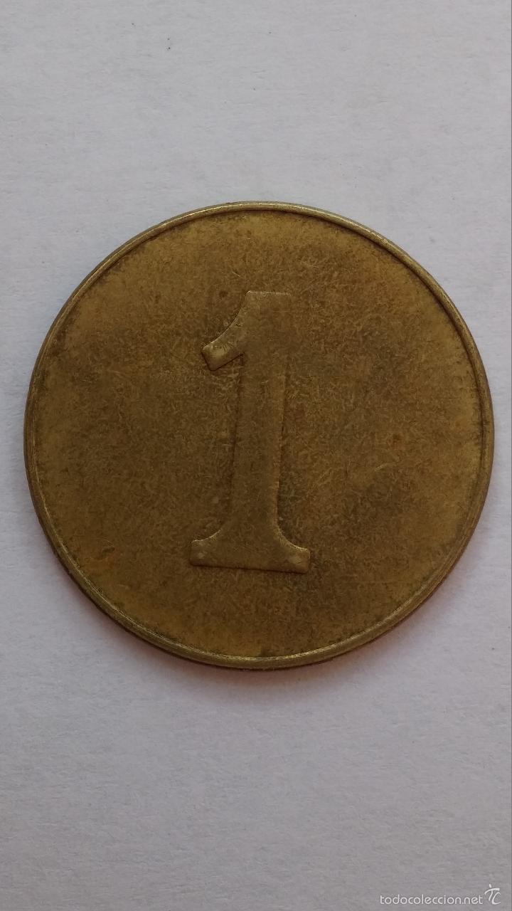 Moedas locais: Ficha ,moneda con un 1 por las dos caras de 2,8 cms de diametro, podria ser de casino